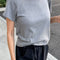 side view of model wearing heather grey tee