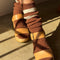model wearing brown socks with two white stripe cuff