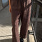 model wearing brown gardners pants with front patches