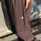 model wearing brown gardners pants with front patches