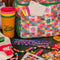 stacked set of 4 colorful plastic stadium cups with 'greetings from camp friendship!' across the front