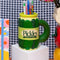 green pickle jar ceramic mug with pickle crunchy dill label and pickle handle with pencils inside