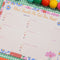 colorful meal planner and shopping list set on a gingham tablecloth