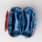 interior of blue quilted zipper makeup bag with red bow handle and all blue floral and bow print