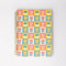 Mini notebook with pink tulip cover design, shown open with lined pages and a pen.