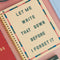cream mini notebook with colorful striped border and teal 'let me write that down before i forget it' on a pink background