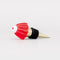 side view of gold brass wine stopper with red jello mold topper and black rubber stopper