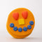 smiling pancake de stress ball with cute face design