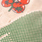 cream gardening gloves with tomato bunches and red trim