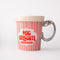 side view of strawberry ice cream carton mug with silver metallic spoon handle