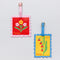 two colorful floral themed postage stamp luggage tag set