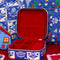 red interior of blue and cream floral print travel jewelry organizer