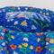 blue quilted tote with colorful folk print