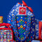 blue quilted tote with colorful folk print on a blue background surrounded by other ban.do product