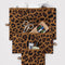 set of three leopard print flat pouch set with items inside
