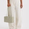 model holding celadon (sage) nylon bowler bag