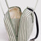interior key leash of sage green and white stripe nylon bowler bag