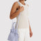 model wearing mist drawstring bag
