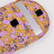 pink 13 in. puffy laptop sleeve with overlapping pluto print with a laptop inside