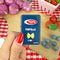 model holding blue pasta box lighter