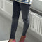 model wearing heather grey ribbed cashmere leggings