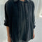 model wearing oversized washed black button down jacket