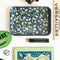 navy trinket tray with white flower print surrounded by cute trinkets