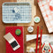 white and blue small trinket tray with snoopy eating strawberries on a desk
