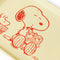 up close of yellow school lunch tray with snoopy and woodstock sharing a snack