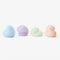 goober collection candles in blue, purple, green and orange