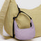 dusty pink mini crescent bag charm on a yellow baggu bag