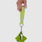 model holding lime green keychain with grey 'baggu' logo and carabiner clip with keys attached