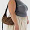 model carrying dark brown leopard medium crescent bag with black strap