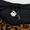 black interior black leash on dark brown leopard medium nylon crescent bag with black strap