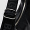 up close of silver buckle on model carrying black leather medium crescent bag