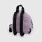 back view of dusty pink mini backpack with black straps and trim
