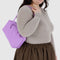 model carrying rose rectangular nylon bowler bag with matching zipper and charm clasp