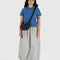 model wearing black small crescent bag with interior key leash