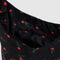 interior zip pocket of black small nylon sling bag with red painted wildflower print