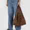 model holding dark brown leopard print standard baggu