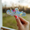 model holding cornflower 'pyrex' inspired suncatcher sticker