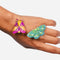 set of three colorful moth hair clips on models hand