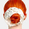 white silky large scrunchie with all over ant print in their hair