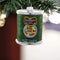 green can of fruit cocktail ornament hanging from a branch