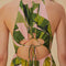 up close of model wearing pink banana leaves maxi dress with ric rac tiers, cut-out top and open back