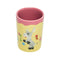 top view of pale yellow and mauve juice glass with donkey and floral print