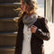 model wearing grey knit triangle essential scarf