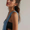 up close of model wearing light denim pull on shortalls with zipper front
