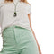 up close of model wearing mint wide leg jeans