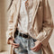 model wearing light blue washed denim with moderate distressing on the hem